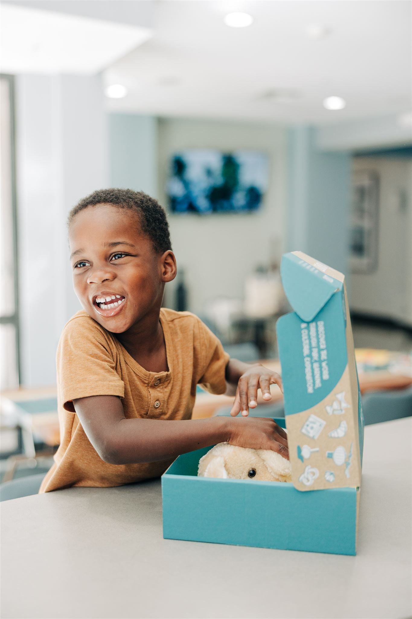 Child opening Global Sprouts Australia Culture Box